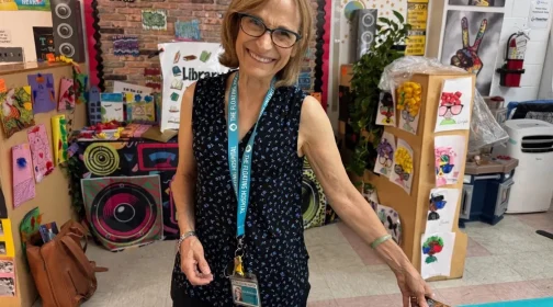 A volunteer among shelves of donated books